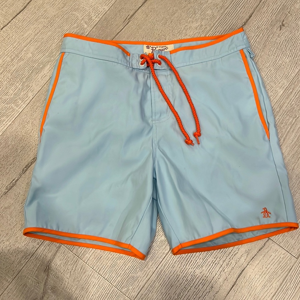 Penguin light blue and orange swim trunks. Size 28 fit large like a size 30